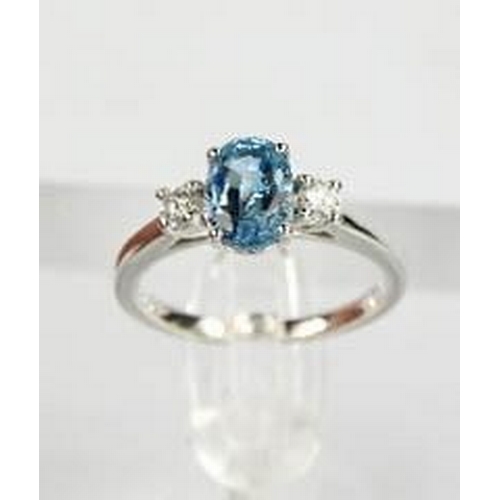 69 - An 18ct white gold, aquamarine and diamond ring, the 1.20ct aquamarine flanked by 0.20cts diamonds i... 