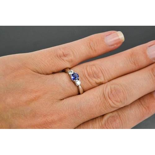 71 - An 18ct white gold, sapphire and diamond trilogy ring, size M, 4.4g.