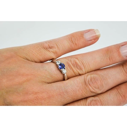 71 - An 18ct white gold, sapphire and diamond trilogy ring, size M, 4.4g.