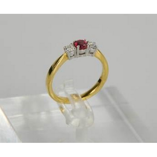 73 - An 18ct yellow gold, diamond and garnet trilogy ring, the central garnet flanked by diamonds, size M... 