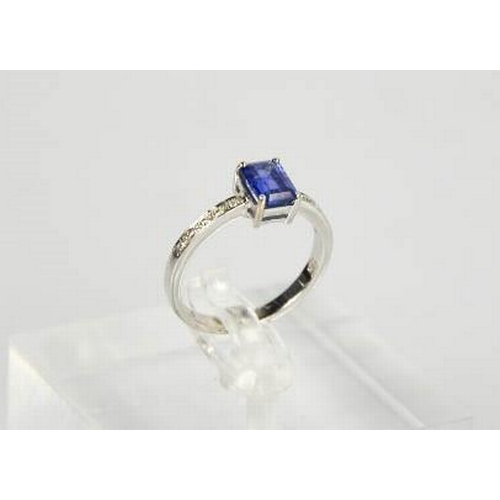 75 - An 18ct white gold, diamond and sapphire ring, the sapphire approximately 0.80ct, with diamond set s... 