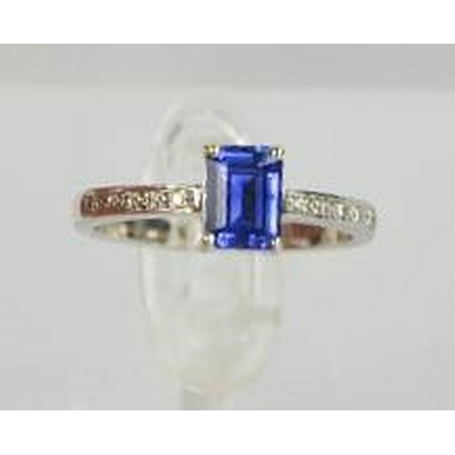 75 - An 18ct white gold, diamond and sapphire ring, the sapphire approximately 0.80ct, with diamond set s... 