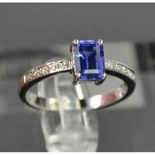 75 - An 18ct white gold, diamond and sapphire ring, the sapphire approximately 0.80ct, with diamond set s... 