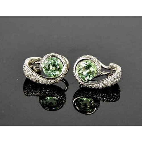 78 - An 18ct green tourmaline and diamond pair of earrings, 10g.