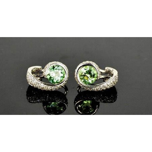 78 - An 18ct green tourmaline and diamond pair of earrings, 10g.