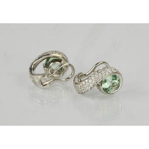 78 - An 18ct green tourmaline and diamond pair of earrings, 10g.