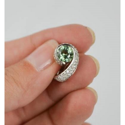 78 - An 18ct green tourmaline and diamond pair of earrings, 10g.