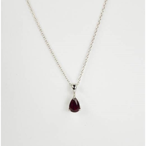 82 - An 18ct white gold and ruby pendant and chain, the pear cut ruby approximately 1.01ct, 2.5g.