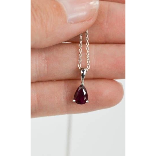 82 - An 18ct white gold and ruby pendant and chain, the pear cut ruby approximately 1.01ct, 2.5g.