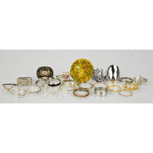 83 - Twenty three rings of differing style, some silver examples.