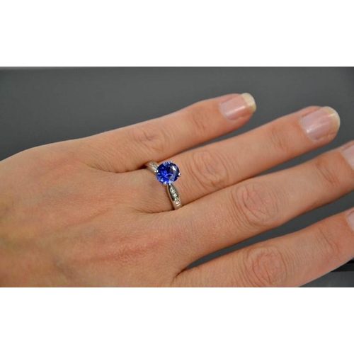 84 - An 18ct white gold, blue sapphire and diamond ring, the sapphire approximately 0.7g, the diamonds to... 