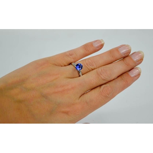 84 - An 18ct white gold, blue sapphire and diamond ring, the sapphire approximately 0.7g, the diamonds to... 