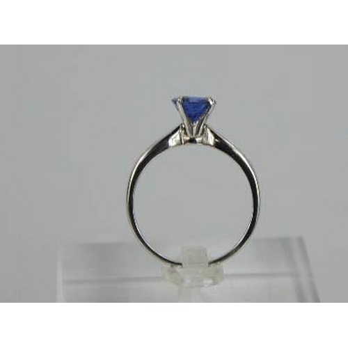 84 - An 18ct white gold, blue sapphire and diamond ring, the sapphire approximately 0.7g, the diamonds to... 