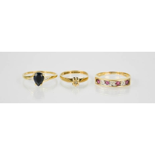 89 - Three 9ct gold rings, one set with four pink rubies and diamonds, size R, 5.6g
