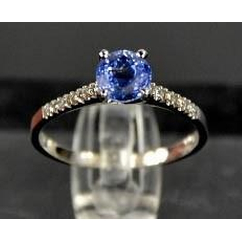 96 - A 14ct white gold, blue sapphire and diamond ring, size M, 1.8g.