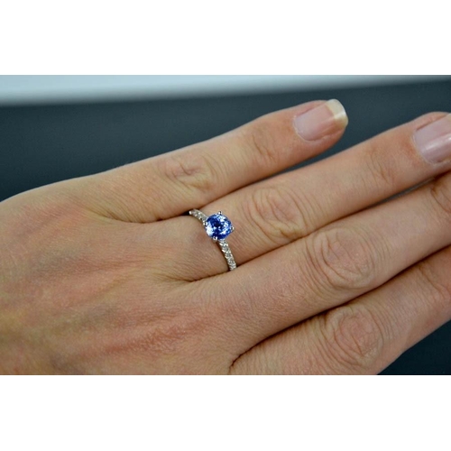 96 - A 14ct white gold, blue sapphire and diamond ring, size M, 1.8g.