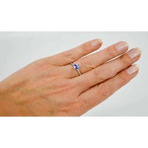 96 - A 14ct white gold, blue sapphire and diamond ring, size M, 1.8g.