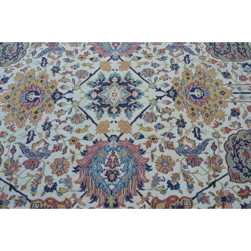 484 - A large carpet in blue, pink and cream 350 by 300cm.