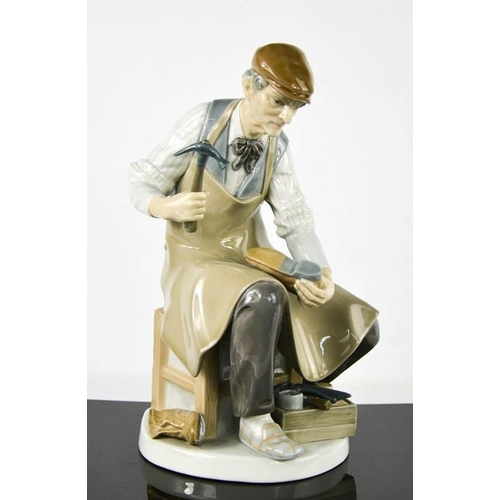 107 - A Lladro porcelain figurine titled The Cobbler, number 4853, 25cm high.