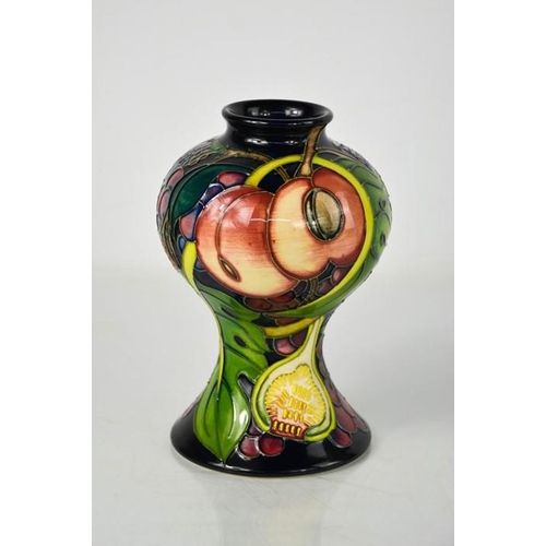 11 - A Moorcroft vase,  in the Queens Choice pattern designed by Emma Bossons, dated 2000, 15cm high.