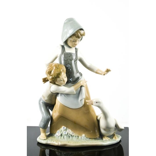 111 - A Lladro porcelain figure group titled Avoiding the Goose, number 5033, 25cm high.