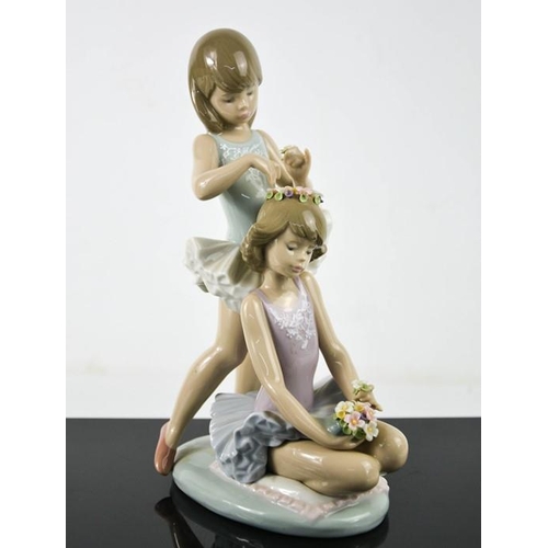 113 - A Lladro porcelain figure group, First Ballet Ballarina's Getting Ready with Flowers, number 5714, b... 