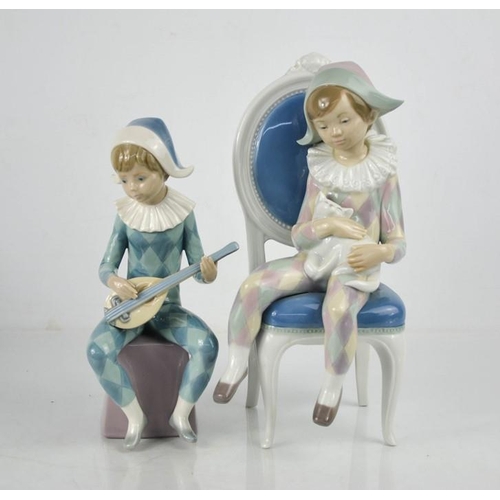 124 - Two Lladro figurines; Harlequin Boy with Cat and Harlequin Playing Mandolin, number 5076, 12cm high.