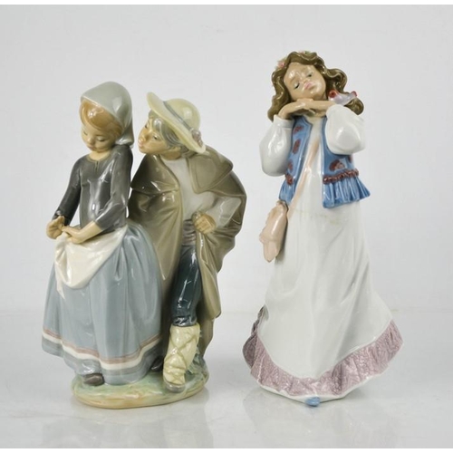 127 - Two Lladro porcelain figurines: Gypsy girl  Lladro Event Figurine 1997, 6401, and Stolen Kiss 22cm h... 