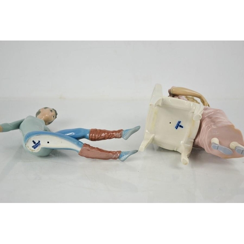 128 - Two Lladro porcelain figurines: Ballerina, and lady seated reading a book, 24cm high.