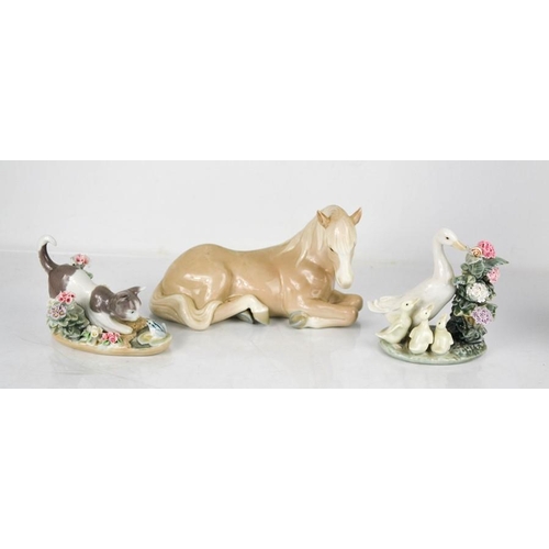 132 - A Lladro porcelain pony, a duck with ducklings & snail, and a kitten & frog, 9cm high.