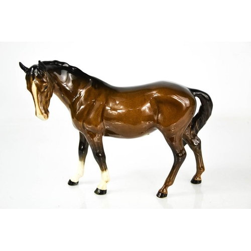 156 - A Beswick brown horse, 17cm high.