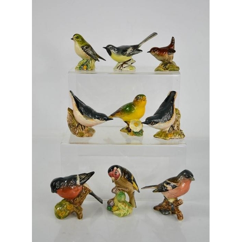 159 - Nine Beswick porcelain model birds, including Bullfinch, Chaffinch, Goldfinch, Nuthatch and others.