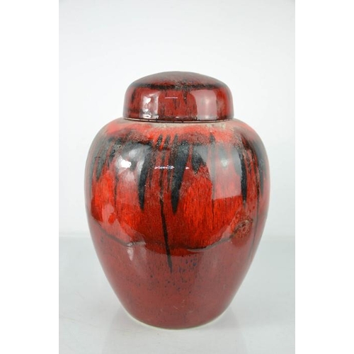 164 - A Poole pottery ginger jar and cover, in red glaze, 31cm high.