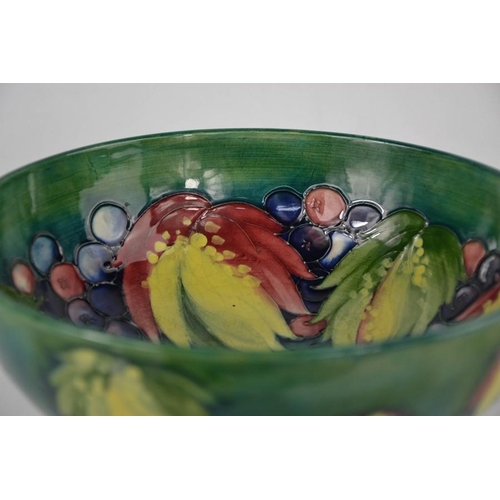 18 - A Moorcroft bowl, signed to the base by William Moorcroft, in the Leaf & Berry pattern, 24cm diamete... 