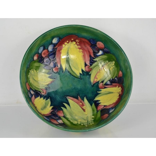 18 - A Moorcroft bowl, signed to the base by William Moorcroft, in the Leaf & Berry pattern, 24cm diamete... 