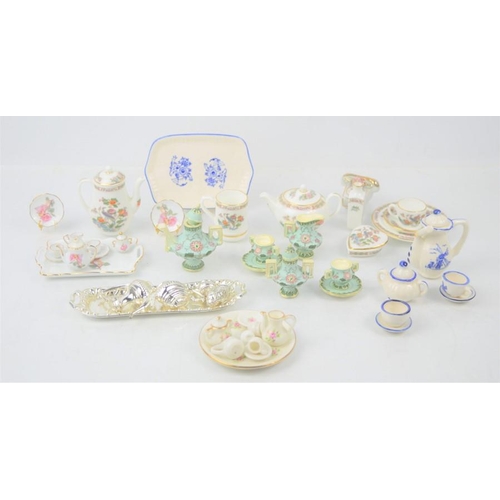 271 - A group of miniature tea sets to include a Wedgwood example