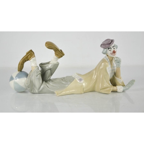 65 - A Lladro figure of a clown 'Payaso Acostado, signed to the base and dated 9.17.86, 38cm long.