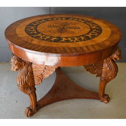 673 - An Art Deco period fiddleback mahogany and marquetry circular centre table, the top with radiating v... 