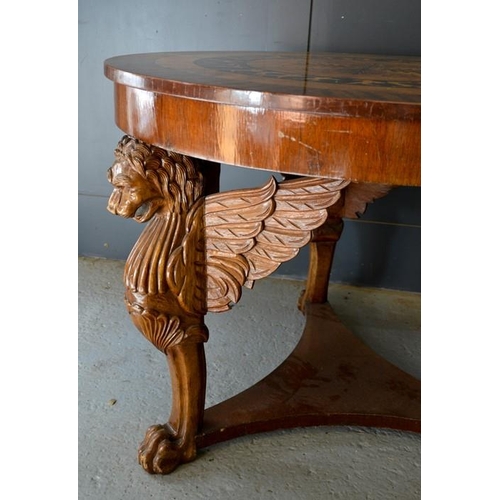 673 - An Art Deco period fiddleback mahogany and marquetry circular centre table, the top with radiating v... 