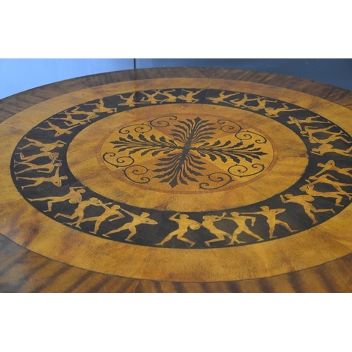 673 - An Art Deco period fiddleback mahogany and marquetry circular centre table, the top with radiating v... 