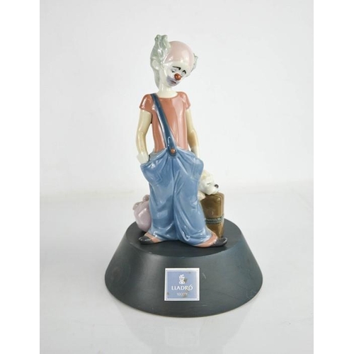 73 - A Lladro porcelain clown on stand, limited edition, signed to the base and dated 11.6.97, 20cm high,... 