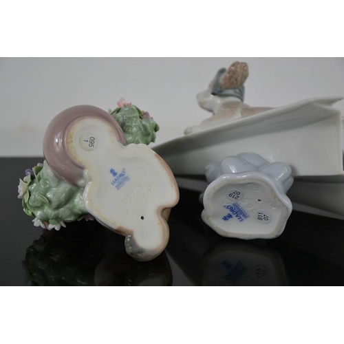 78 - A Lladro porcelain puppy with flowers, and 'Lets Fly Away', numbered 6665, with the original box.