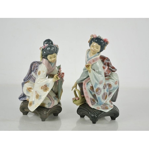 83 - Two Lladro porcelain geisha girls picking flowers.