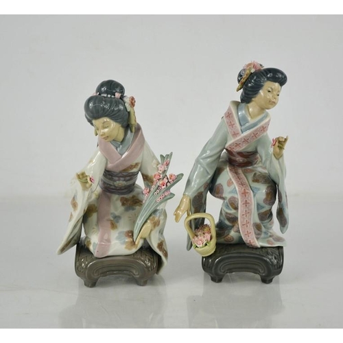 83 - Two Lladro porcelain geisha girls picking flowers.