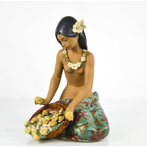 92 - A Lladro porcelain Hawaiian girl with basket of flowers, 26cm high.