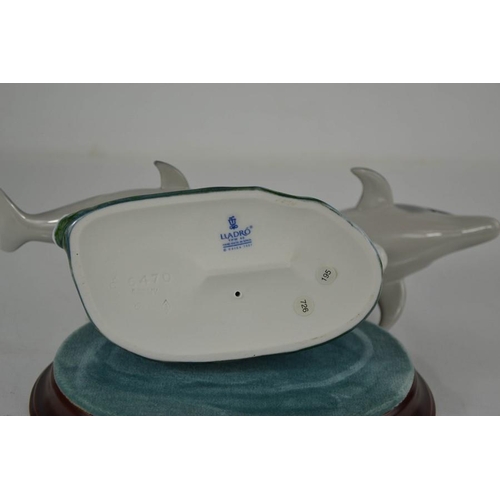 93 - A Lladro porcelain group titled Swimming Lesson, impressed 6470 to the base, with wooden stand, 18cm... 