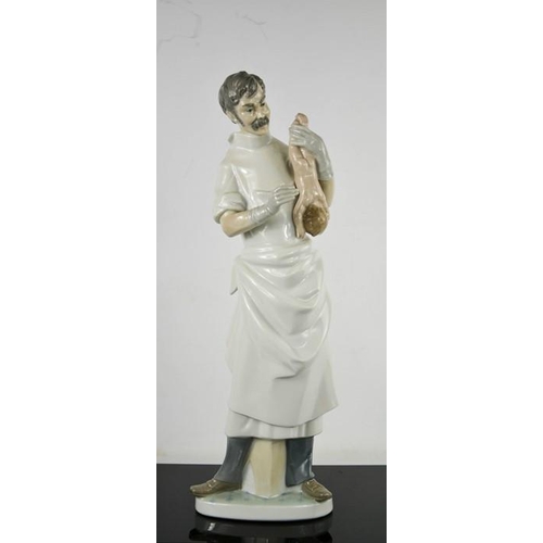 94 - A Lladro porcelain Obstetrician with Newborn Baby, numbered 4763, 36cm high.