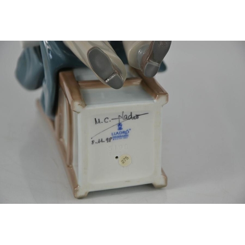 95 - A Lladro porcelain figurine, Boy Graduate, signed to the base MC Lladro and dated 8.11.98, 28cm high... 