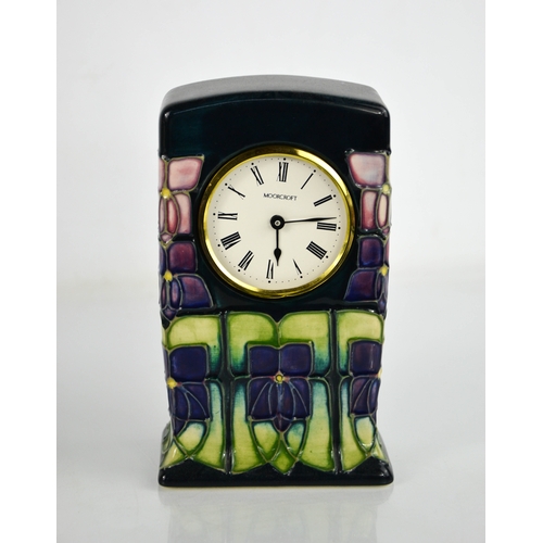 24 - A Moorcroft pottery clock, inspired by the design for Liberty's by Archibald Knox, initialled WM to ... 