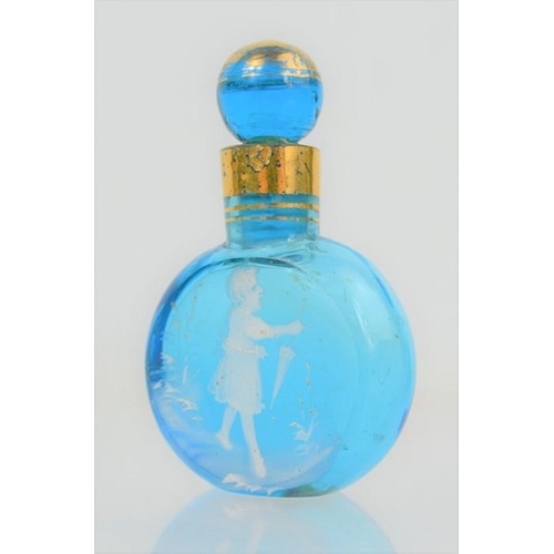 131 - An Edwardian blue glass and gilt scent bottle, hand painted in white to depict girl with umbrella, 7... 